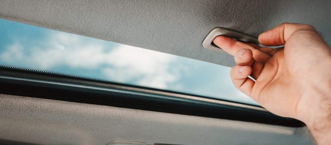 Glass sunroof for lighting and air circulation - the driver opens the sunroof